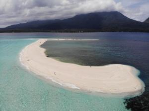 an aerial view of an island in the ocean at Happy Coconut Camiguin in Mambajao