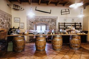 a kitchen with a counter with food on top of barrels at Agriturismo Le Caldane in Colà di Lazise