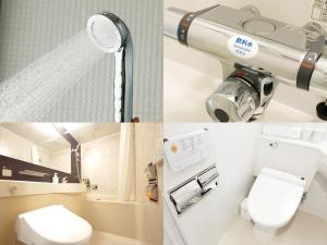 a bathroom with a sink and a toilet and a telescope at APA Hotel Tonami Ekimae in Tonami