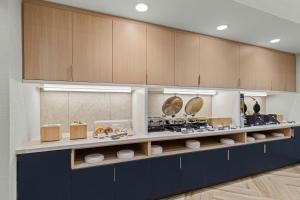 a display case in a store with a bunch of food at TownePlace Suites by Marriott Murfreesboro in Murfreesboro