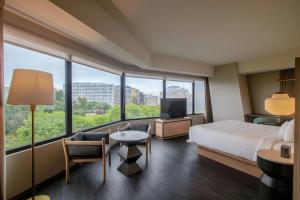 a hotel room with a bed and a large window at Fairfield by Marriott Lima Miraflores in Lima +66 photos