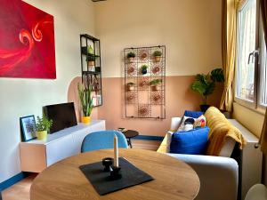 a living room with a table and a couch at Buda's Hidden Heaven 1 with Private Sauna in Budapest