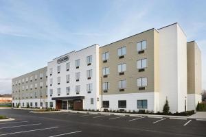 an empty parking lot in front of a building at StudioRes by Marriott Oak Ridge in Oak Ridge