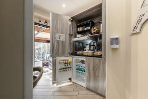 a kitchen with an open refrigerator at 4 Rent di Cicchinelli Lorella in Albano Laziale