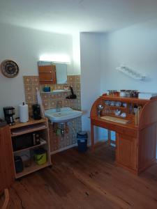a small kitchen with a sink and a counter at Gästehaus Stolzalpe in Stolzalpe
