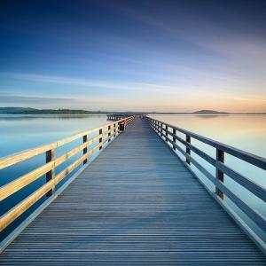 a wooden bridge over a body of water at Fewo Steuerbord in Braunsbedra