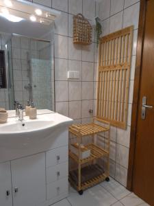 a bathroom with a sink and a shower at Pauza Plac in Žitence +39 photos