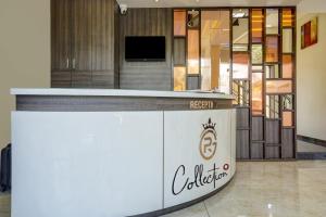 a lobby with a reception counter in a building at Townhouse Poona Royal in Pune