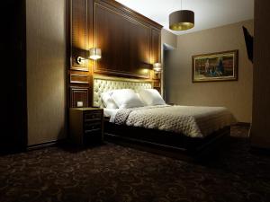 Katil atau katil-katil dalam bilik di Rozafa Hotel