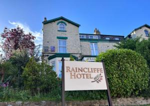 a hotel sign in front of a building at The Raincliffe Hotel in Scarborough