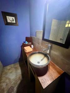 a bathroom with a sink and a mirror at GinTonic Rancho in San Luis +18 photos
