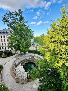 a fountain in a park with a statue at Hotel Restaurant Zum Hirschen in Donaueschingen