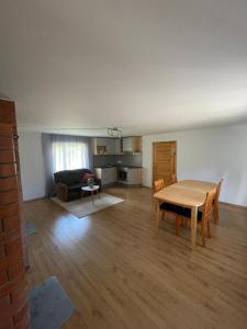 a living room with a table and a couch at Mihkli majutus in Rootsiküla