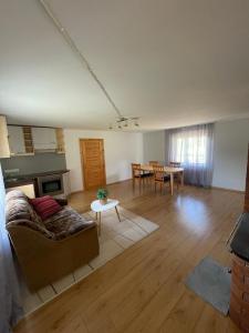 a living room with a couch and a table at Mihkli majutus in Rootsiküla