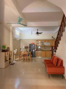 a living room with a couch and a table at Ribi Home in Hà Ðông
