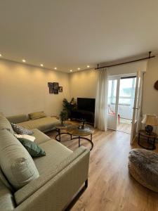 a living room with a couch and a table at Balcón del cubo in Covaleda