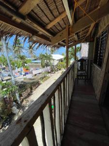 a porch of a resort with a view of the beach at Nana's House in San Isidro