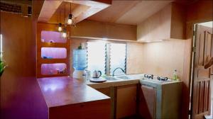 a small kitchen with a sink and a window at Nana's House in San Isidro
