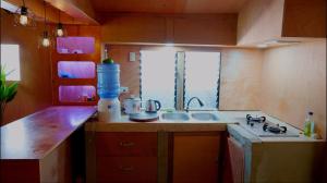 a small kitchen with a sink and a window at Nana's House in San Isidro +9 photos