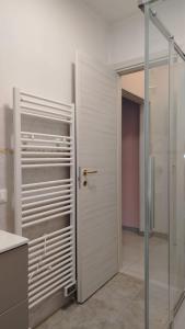a bathroom with a shower and a glass door at La Casetta Di Cotignola in Cotignola