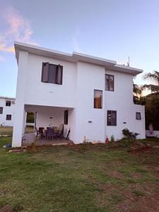 a large white house with a yard at Cool Breeze Villa No 2 in Grand-Baie