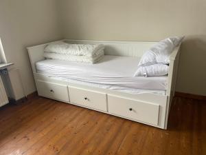 a white bed with two pillows on top of it at Hausamaarbach in Willingen