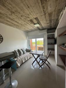 a living room with a couch and a table at Arenas Garzón in José Ignacio