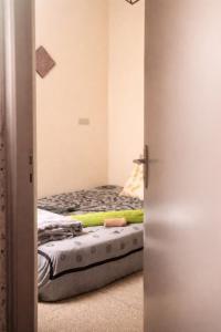 a small bedroom with a bed in a room at Budget Friendly -Private Room in a Moroccan Home - Host On Site in Agadir +10 photos