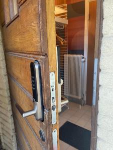 a door with a phone sticking out of it at Örkelljunga overnight stay in Orkelljunga