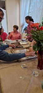 a group of people sitting around a table at DINA in Sisian