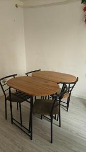 a wooden table with two chairs around it at Ultracentral Biblioteca in Caracal +11 photos