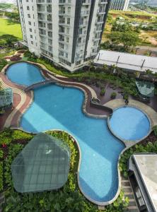an overhead view of a swimming pool in a building at Casa De Parco Apartment Max 4 Guests in Samporo