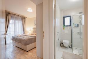 a bedroom with a bed and a bathroom with a shower at Ralux apartman Tivat in Tivat +125 photos