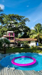 a large swimming pool in a yard with a house at Melo Capurganá Social Hostel in Capurganá