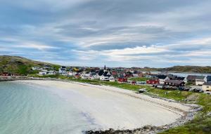 an aerial view of a beach and houses at Holiday Suite in Bugøynes