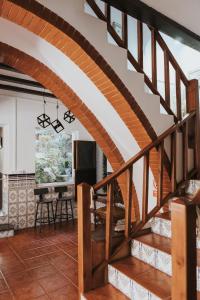 a spiral staircase in a house with a living room at Casa de la Cueva in Figueroles