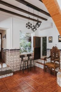 a living room with a table and a chair at Casa de la Cueva in Figueroles