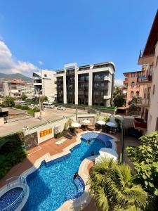 an overhead view of a resort with two swimming pools at SA Apartments! Luxury 2BR with Private Beach Access in Alanya