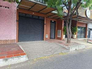 a building with a garage door on the side of it at San Luis Apartamento 101 Cúcuta in Cúcuta +5 photos