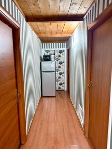 a hallway with a refrigerator in a room at Vittorio Central Park Guest House in Rome