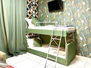 a bunk bed in a room with a wall at Vittorio Central Park Guest House in Rome