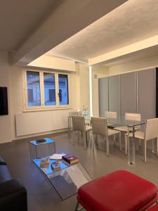 a living room with a table and chairs at Cortirola luxury apartment in Pesaro