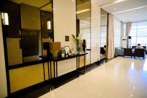 an office lobby with a desk with flowers on it at Budget Friendly Centrio Tower Studio Unit PoolView in Cagayan de Oro