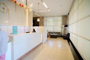 a lobby of a hospital with a waiting room at Budget Friendly Centrio Tower Studio Unit PoolView in Cagayan de Oro +26 photos
