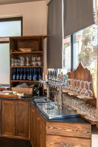 a kitchen with a counter with glasses on it at Dal Brascin in Corio +70 photos