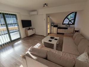 a living room with a couch and a table at Srce Fojnice in Fojnica