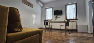 a living room with a table and a couch at Vila Alexandra - Prime accomodation - Pumo Properties in Bucharest