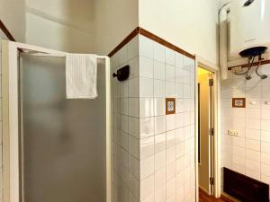 a bathroom with a shower with a towel at Vintage Flat, Centro storico, Cagliari in Cagliari