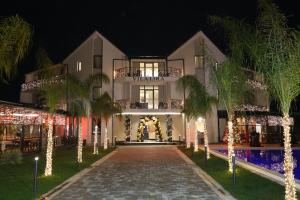 a building decorated for christmas with christmas lights at Vila Lira in Durrës