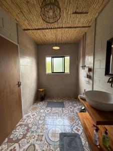 a bathroom with a tub and a sink at Glorious Stay in Porterville +39 photos